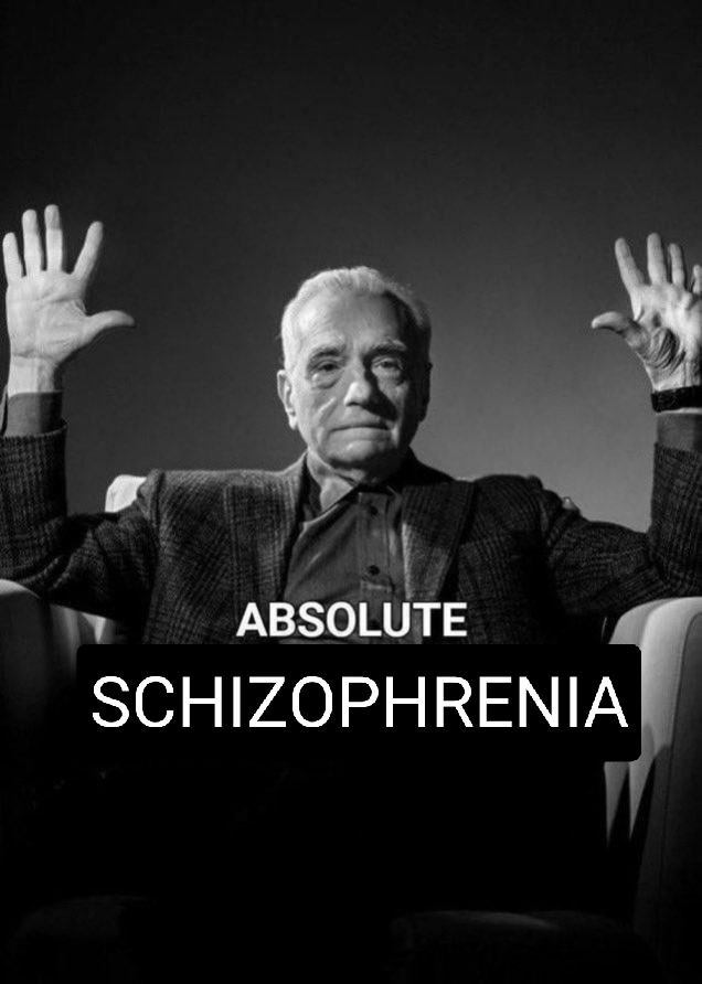 Absolute Schizophrenia Мужчина в кресле с поднятыми руками и текстом "Absolute Schizophrenia"