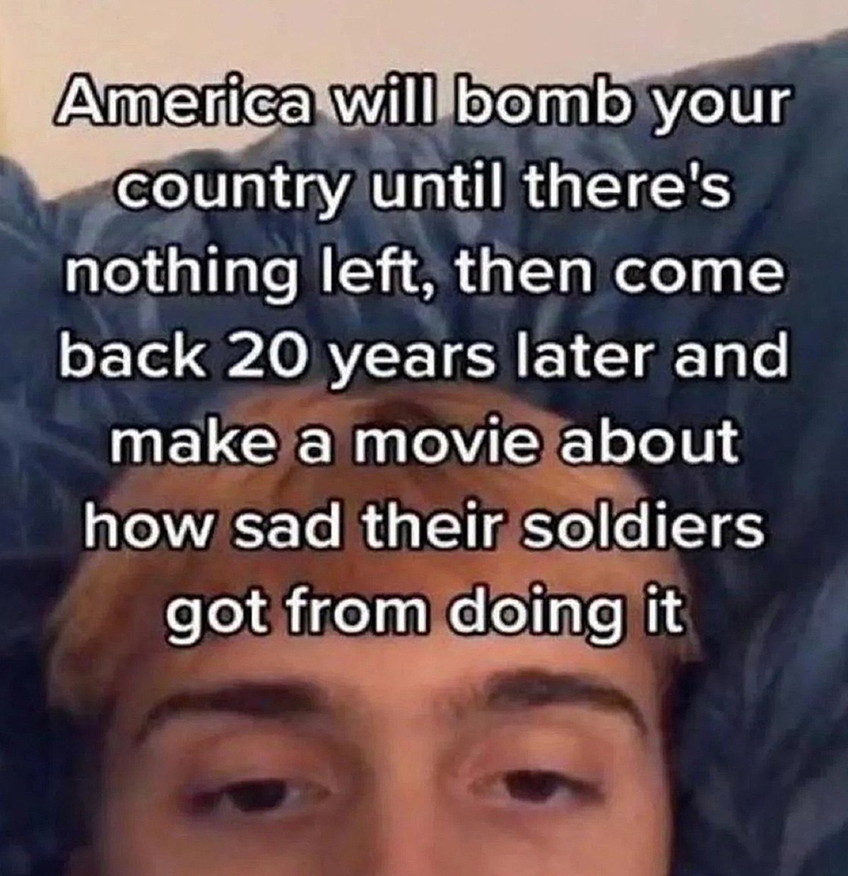 America will bomb your country until there’s nothing left Человек с рыжими волосами и текстом про то, как Америка бомбит страны и снимает об этом фильмы