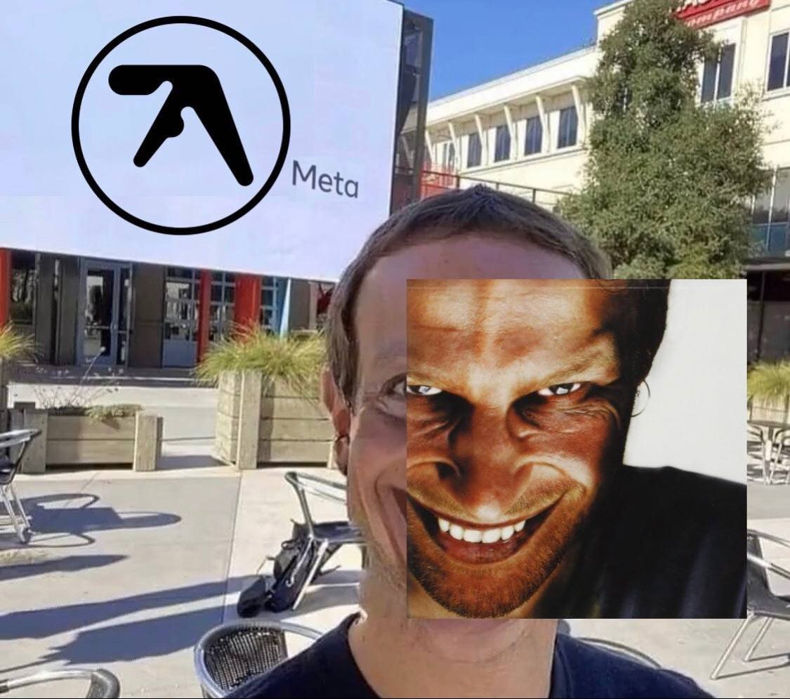 Aphex Twin Meta Цукерберг Мем с логотипом Aphex Twin на билборде с надписью «Meta», частично закрытый лицом Цукерберга и изображением с обложки альбома Aphex Twin, которое наложено на его лицо