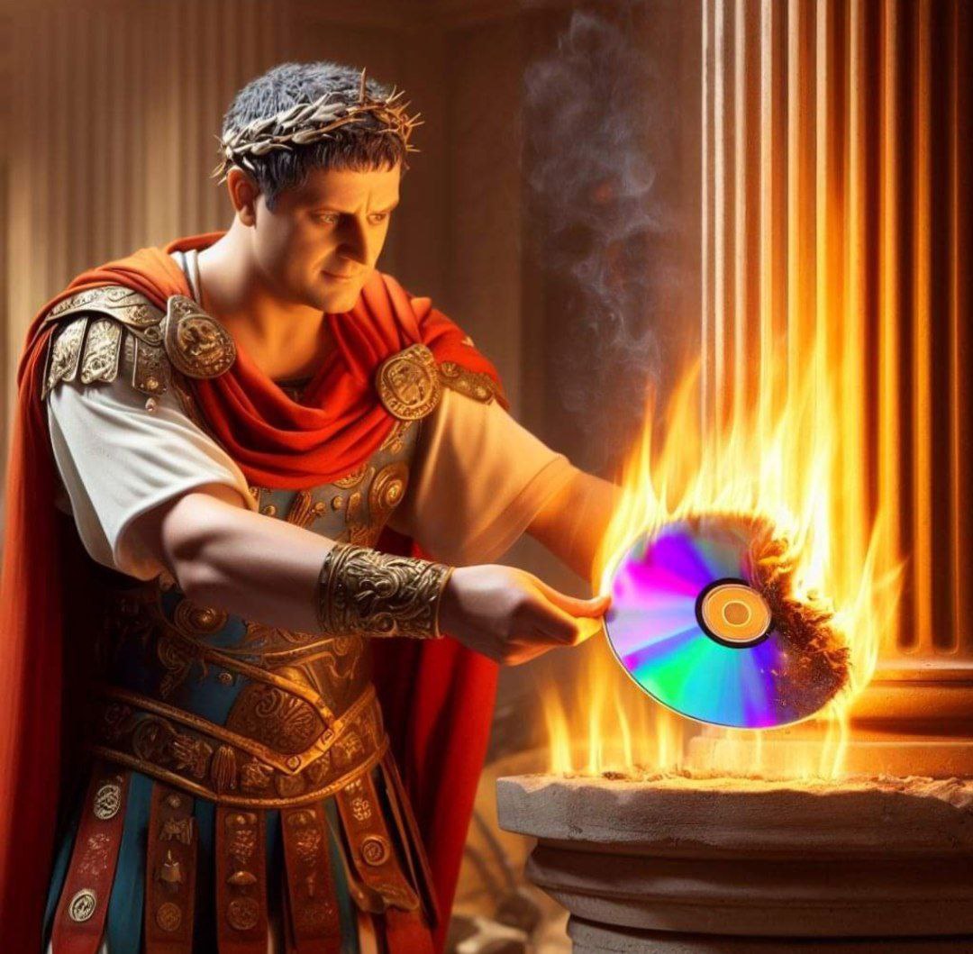 Цезарь сжигает диск Римский император Гай Юлий Цезарь сжигает радужный компакт-диск на алтаре, возможно, с запрещёнными файлами или музыкой