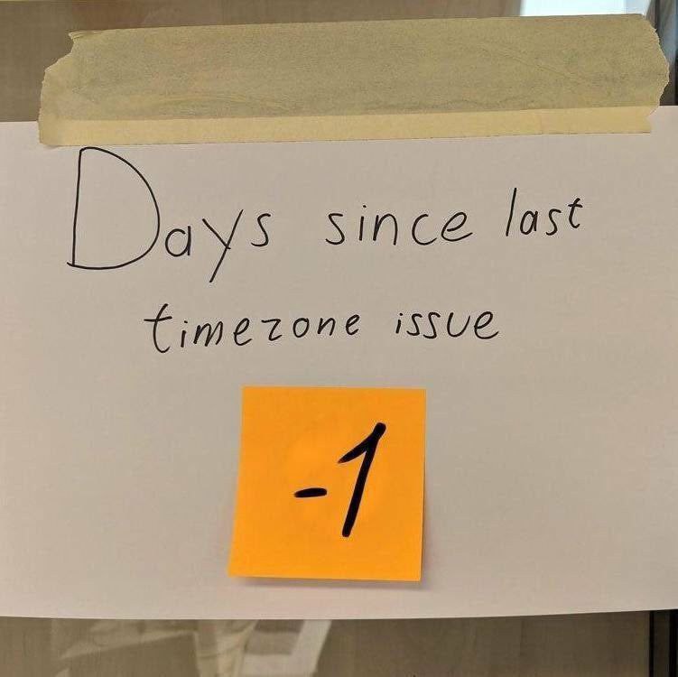Days since last timezone issue -1 Лист бумаги с надписью «Days since last timezone issue» и оранжевый стикер с числом -1