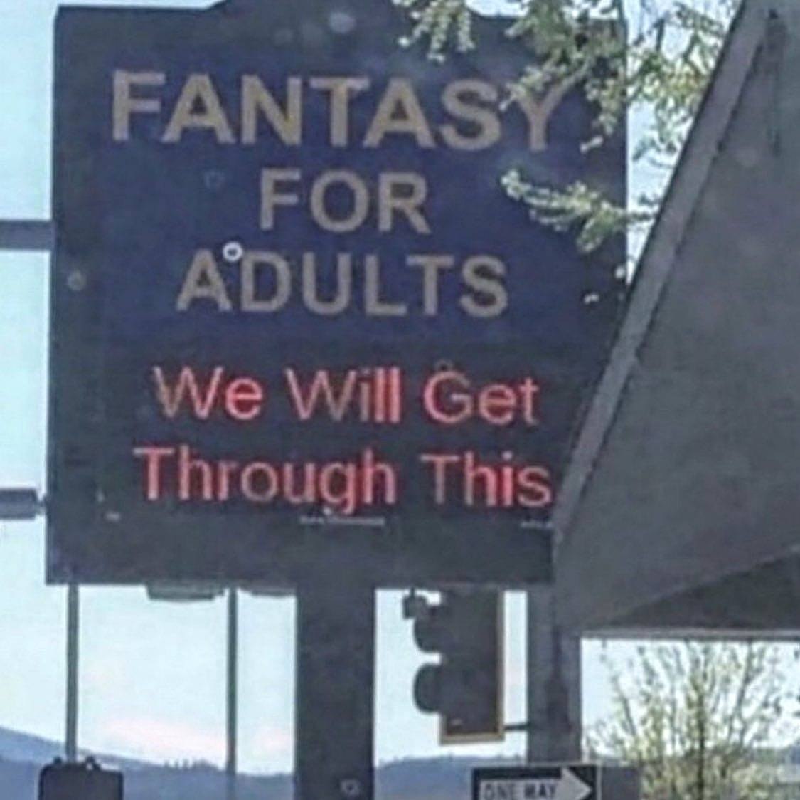 Забавная вывеска «FANTASY FOR ADULTS» с неожиданным продолжением «We Will Get Through This» — «Мы справимся с этим».