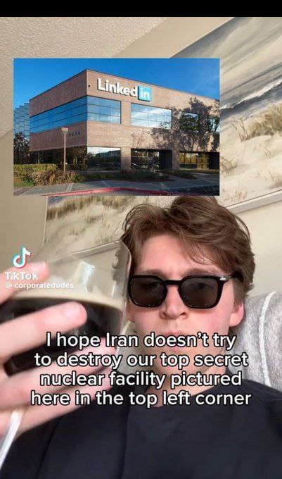 I hope Iran doesn't try to destroy our top secret nuclear facility pictured here in the top left corner Мужчина в солнцезащитных очках со стаканом напитка на фоне здания LinkedIn с надписью «I hope Iran doesn't try to destroy our top secret nuclear facility pictured here in the top left corner».