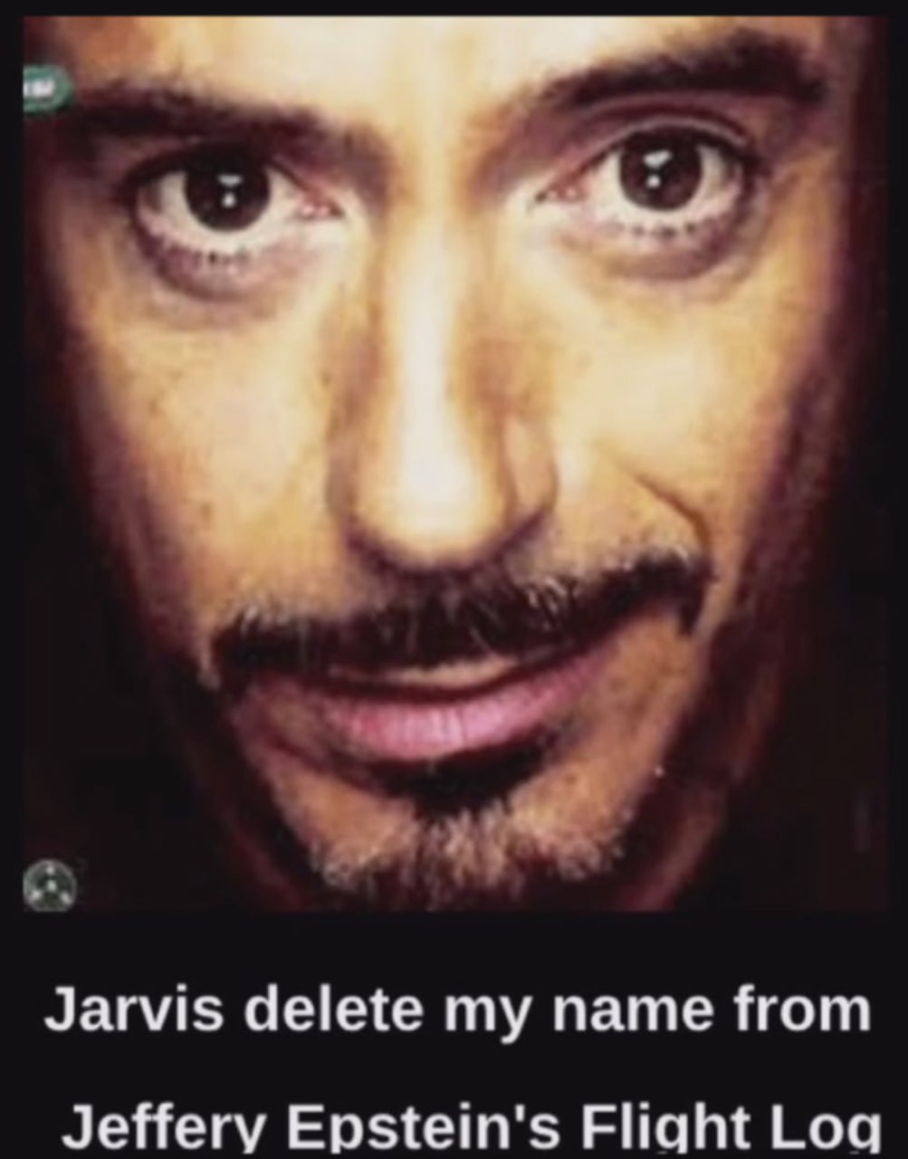 Jarvis delete my name from Jeffery Epstein’s Flight Log Лицо Роберта Дауни-младшего с хитрой ухмылкой и фраза о Джеффри Эпштейне