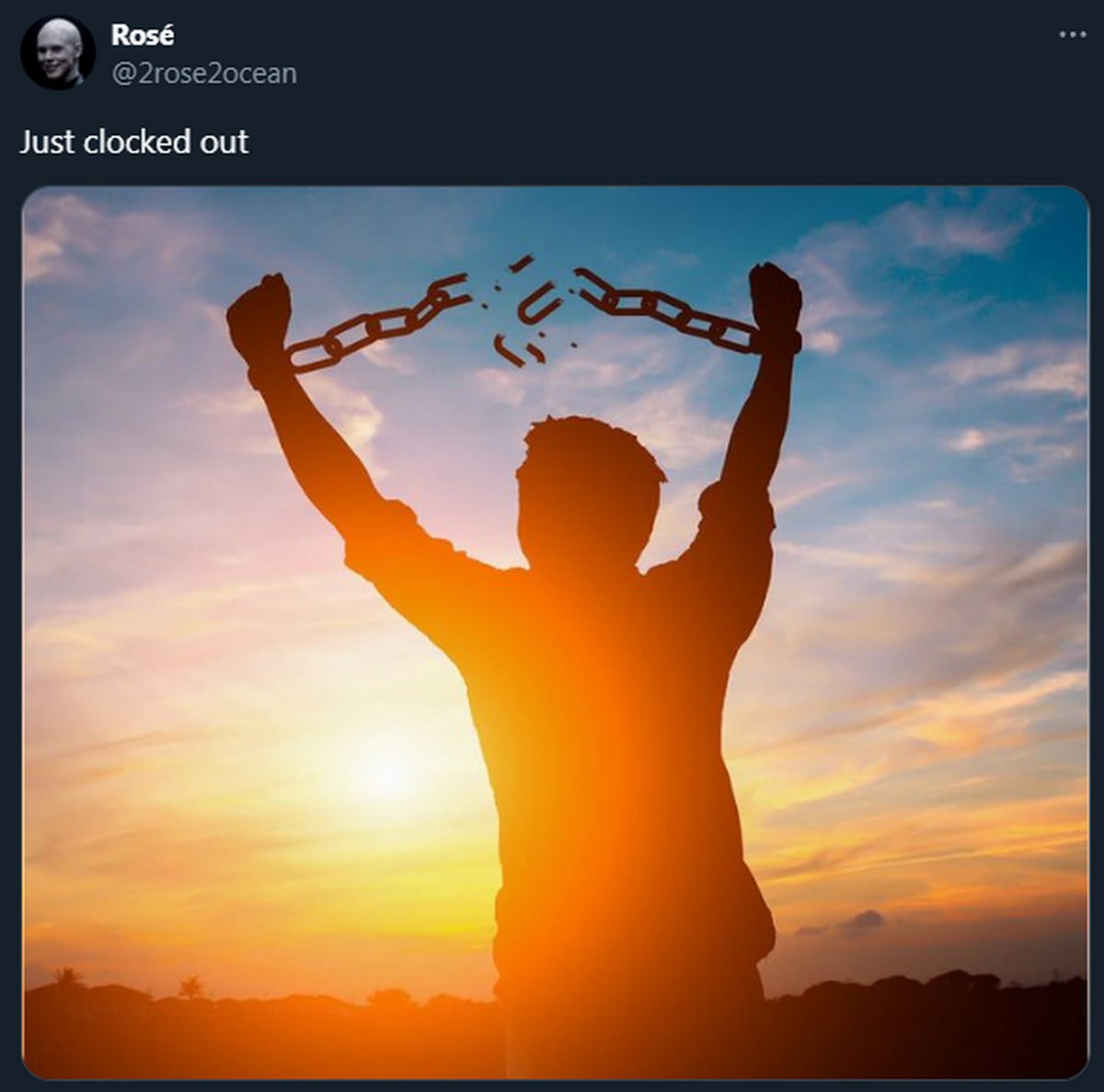 Just clocked out Человек с разорванными цепями на фоне заката и подписью Just clocked out