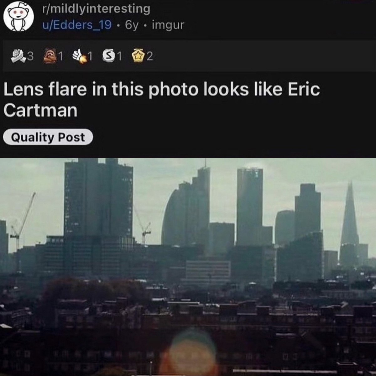 Lens flare in this photo looks like Eric Cartman Оптический блик в виде Эрика Картмана на фотографии города