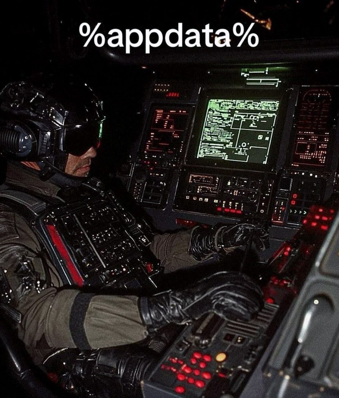 Мужчина в кабине пилота %appdata% Мужчина в кабине пилота управляет сложной панелью управления, а над ним написано «%appdata%»