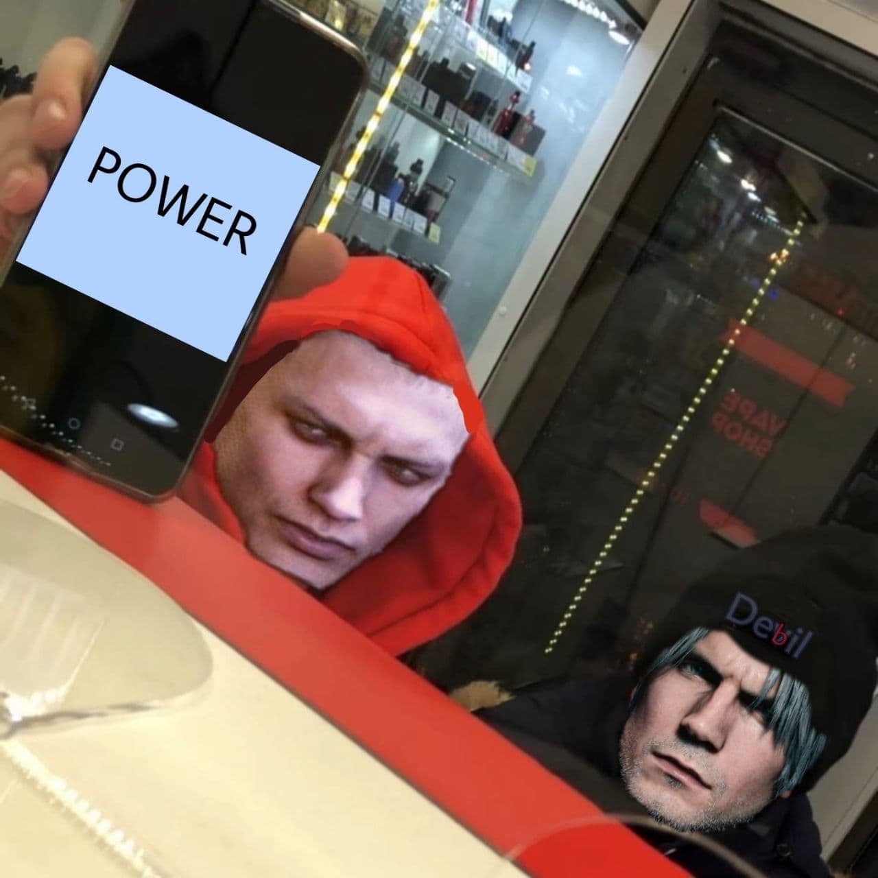 Мем с Неро, показывающим телефон Данте со словом «Power» На меме Неро в красном капюшоне протягивает телефон Данте в шапке с надписью «Devil», на экране телефона слово «Power».