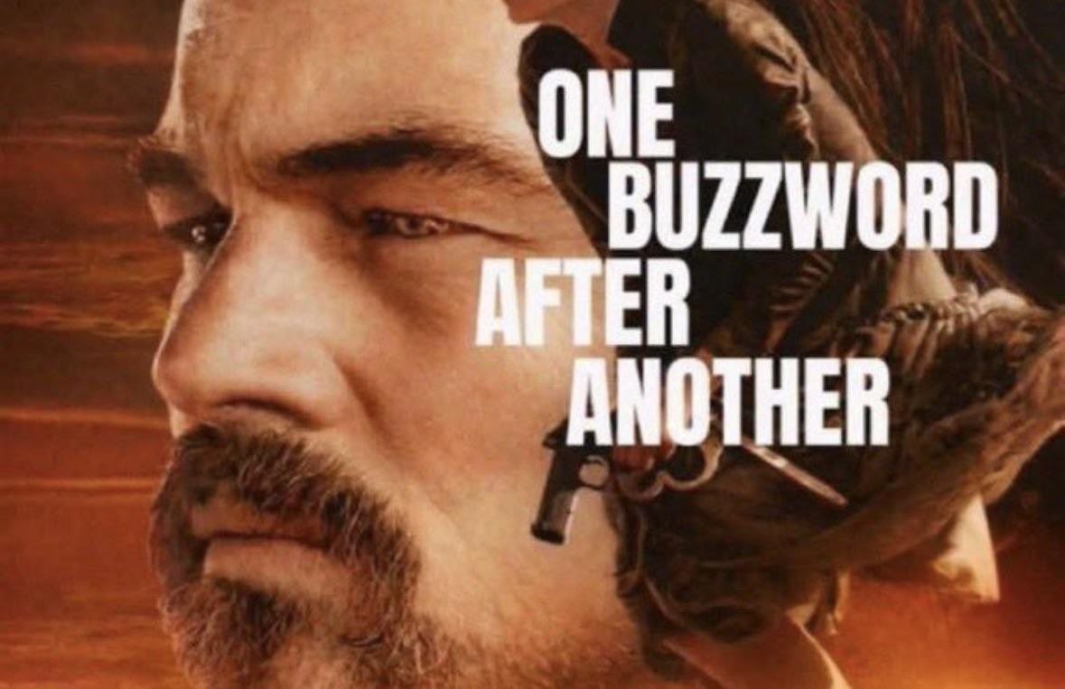 Суровый мужчина и вооружённый персонаж на фоне с надписью «One buzzword after another» — одно модное словечко за другим.