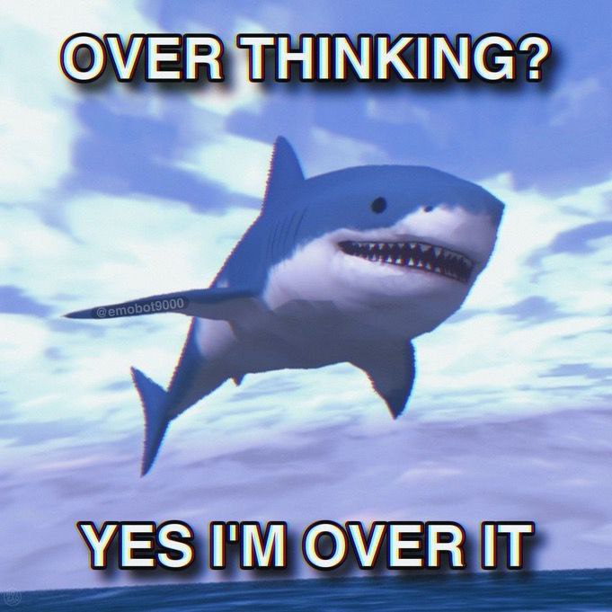 Мем с акулой и фразой "OVER THINKING? YES I'M OVER IT" на фоне неба