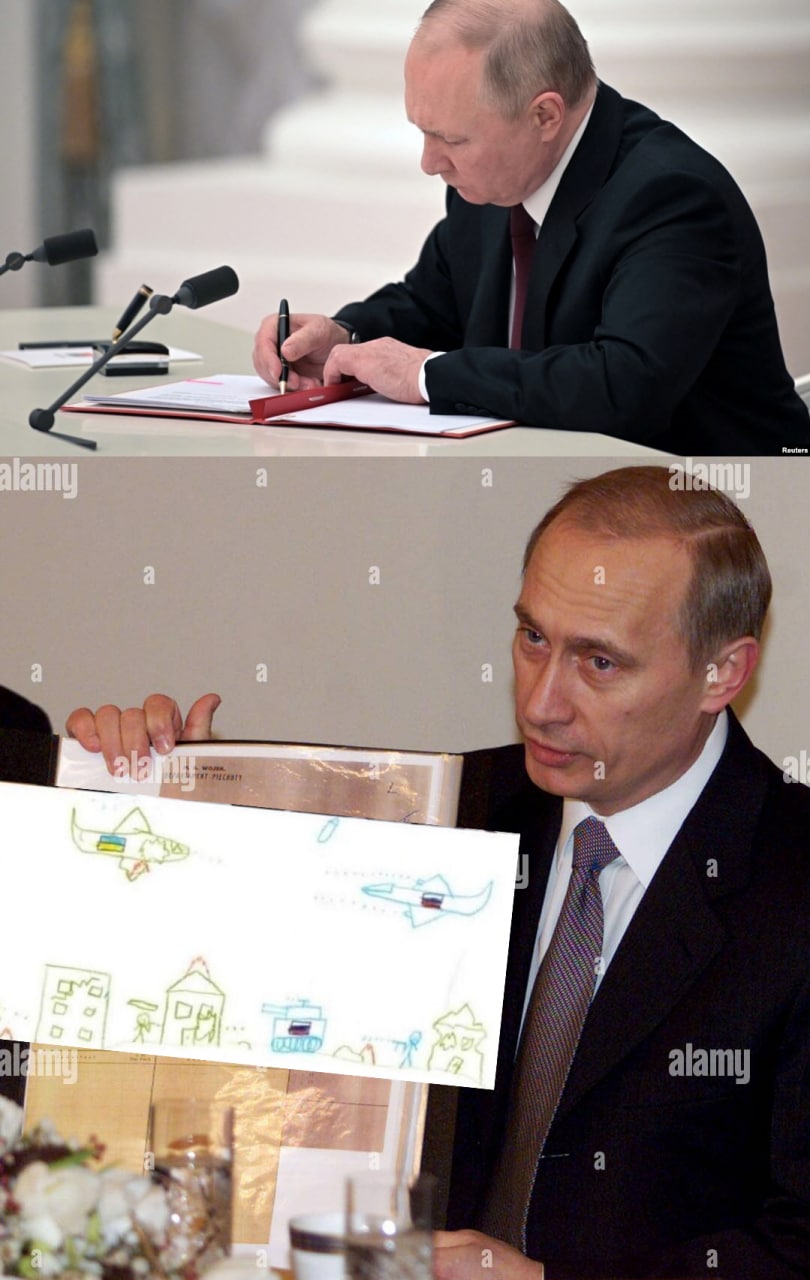 Путин подписывает детский рисунок Владимир Путин подписывает документ, а затем держит в руках детский рисунок с самолетами и танком