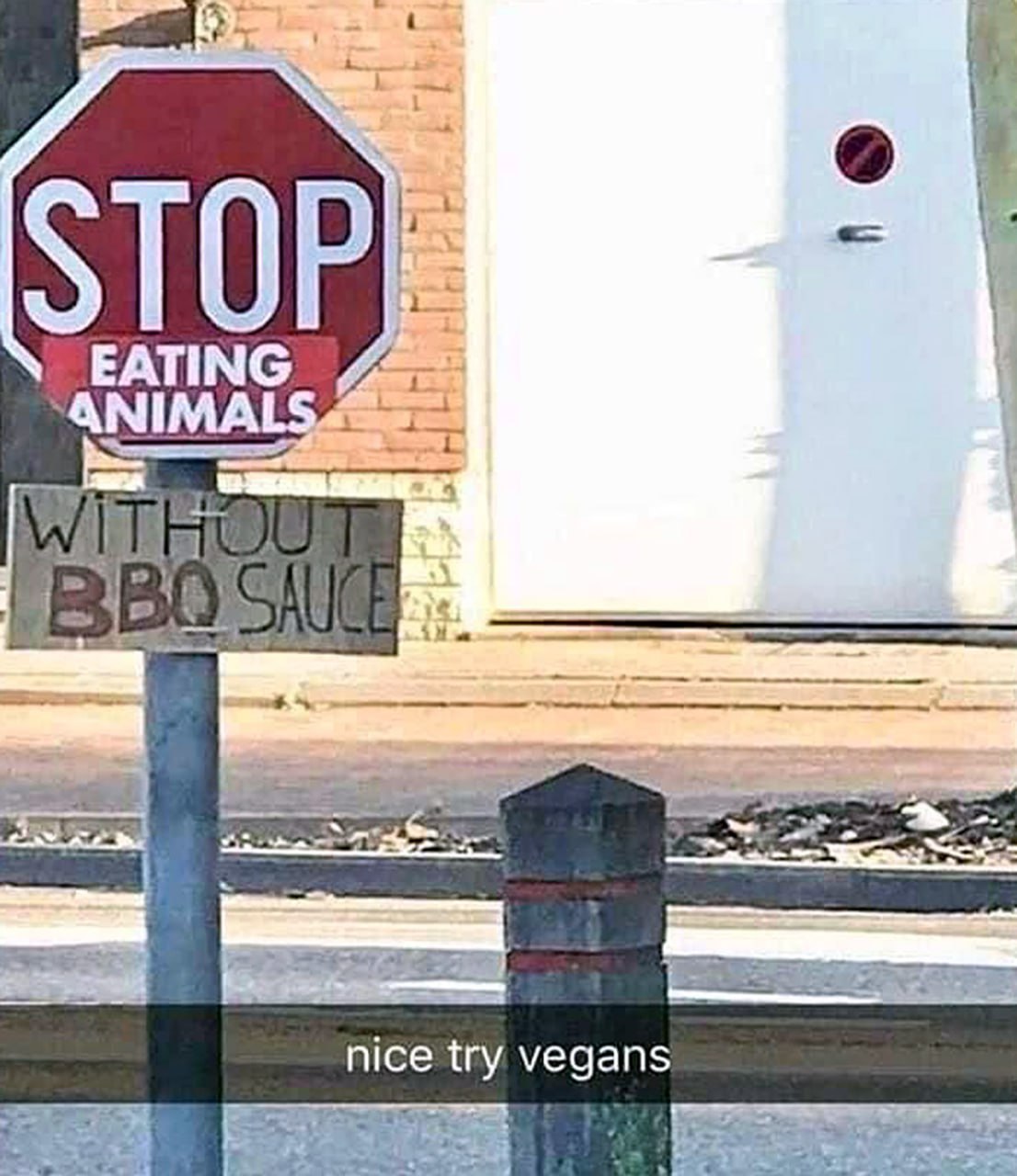 STOP EATING ANIMALS WITHOUT BBQ SAUCE Дорожный знак STOP EATING ANIMALS с добавлением WITHOUT BBQ SAUCE и подписью nice try vegans