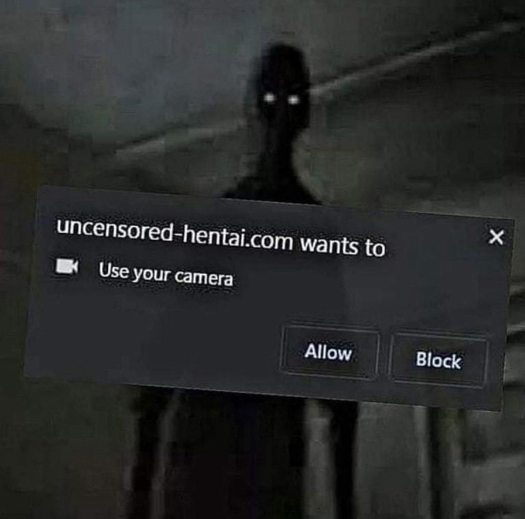 Uncensored-hentai.com хочет использовать вашу камеру Запрос на использование камеры от uncensored-hentai.com и жуткая фигура на фоне.