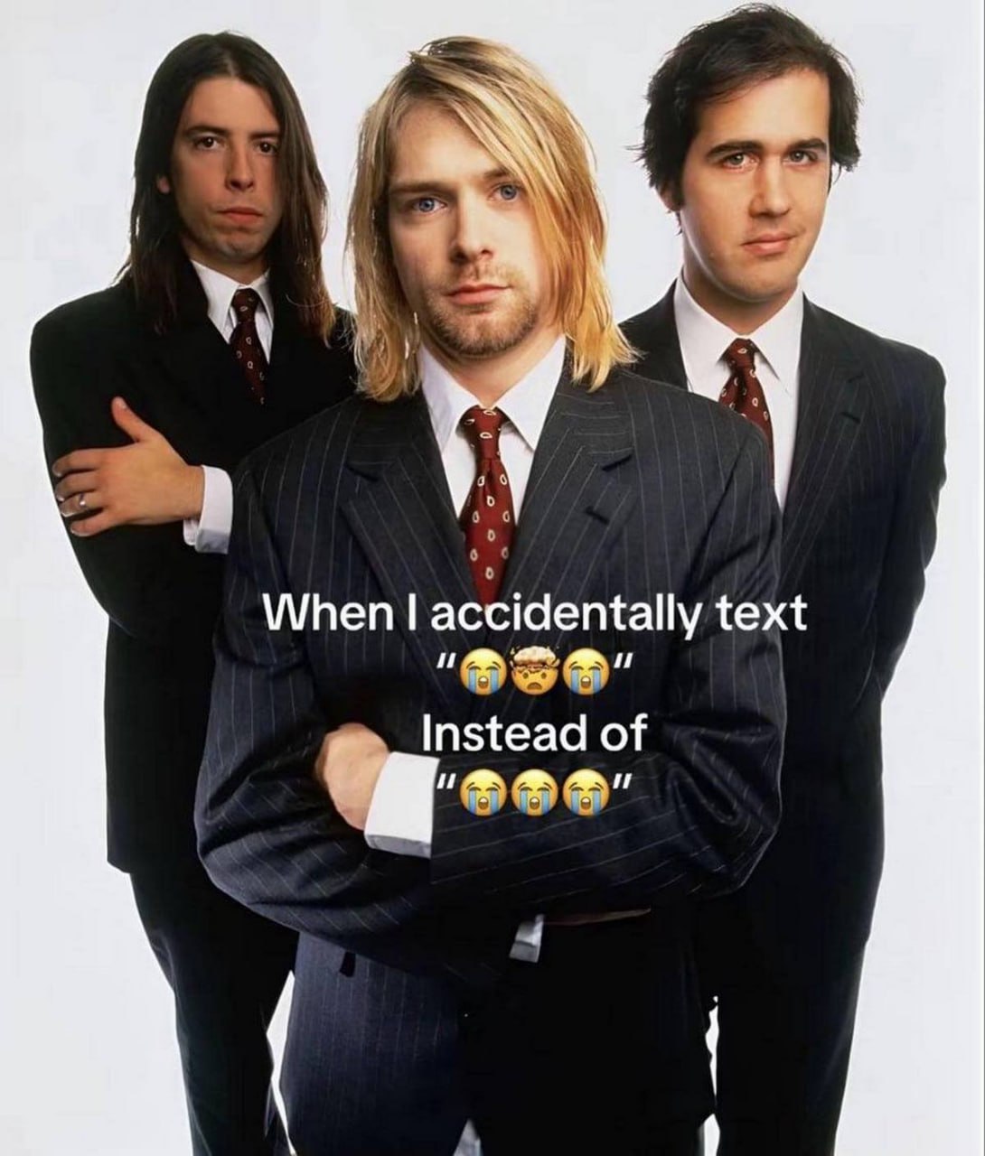 When I accidentally text "" instead of "" Мем с Куртом Кобейном и участниками группы Nirvana в строгих костюмах, когда случайно отправляешь не те эмодзи.