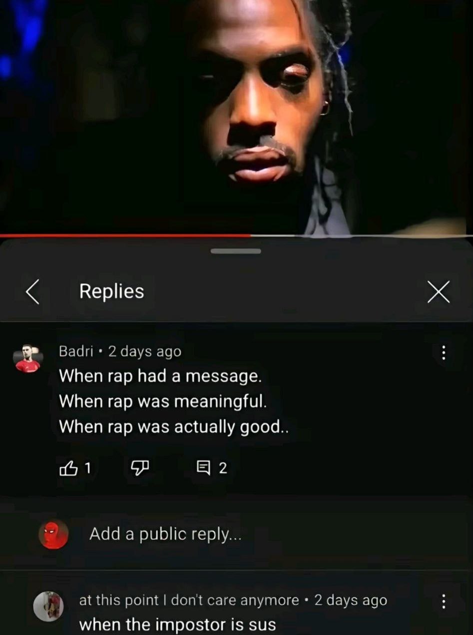 When the imposter is sus Скриншот с YouTube, где на видео изображён грустный мужчина с заплетёнными волосами, а в комментариях пользователь под ником Badri пишет о том, что раньше рэп был со смыслом, а ему отвечает другой пользователь "when the imposter is sus".